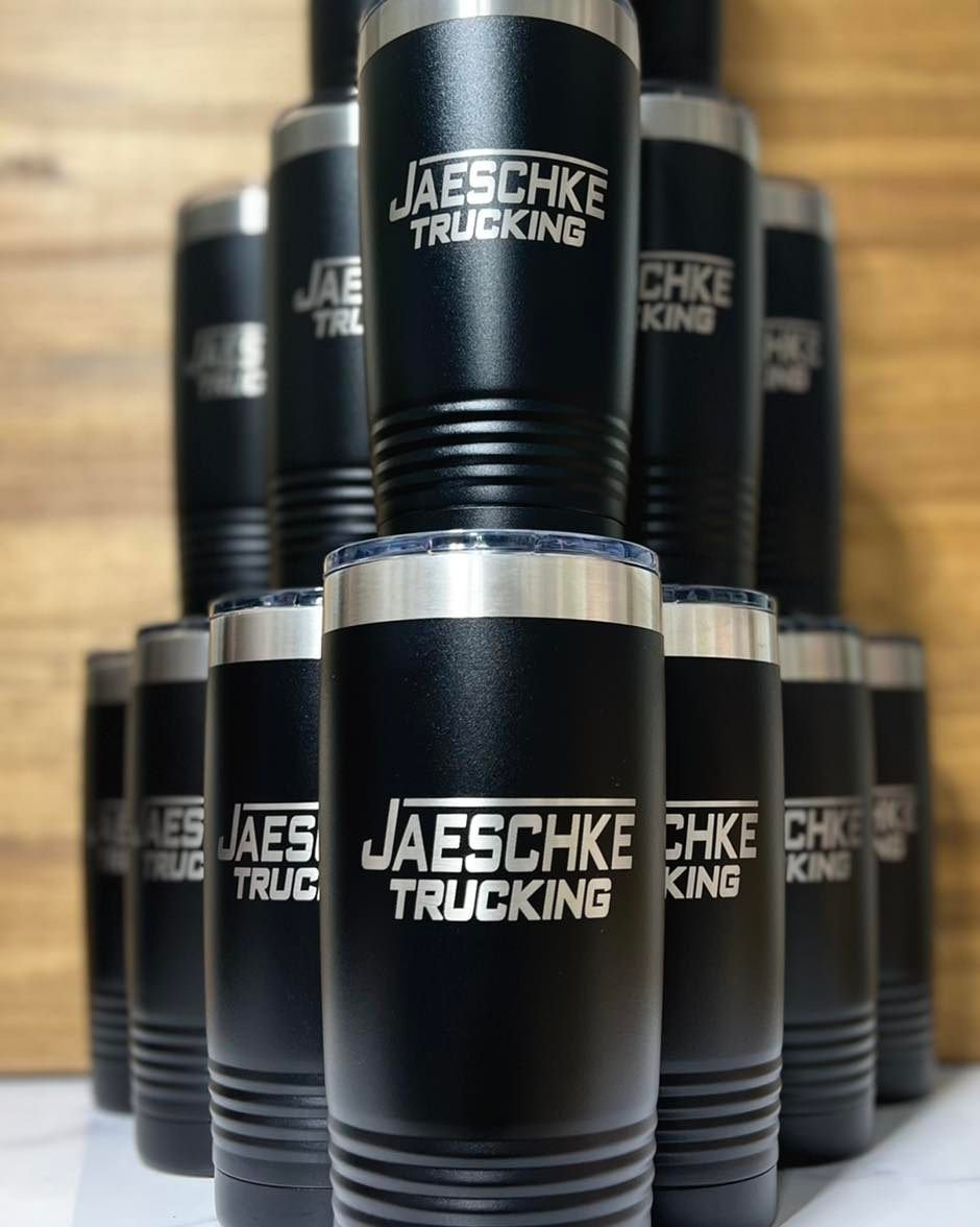 Custom engraved Jaeschke Trucking matte black tumblers — bulk corporate order by Walsh Engraving