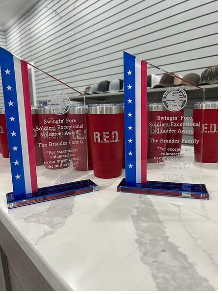 Swingin Fore Soldiers Exceptional Volunteer Award plaques and R.E.D. tumblers